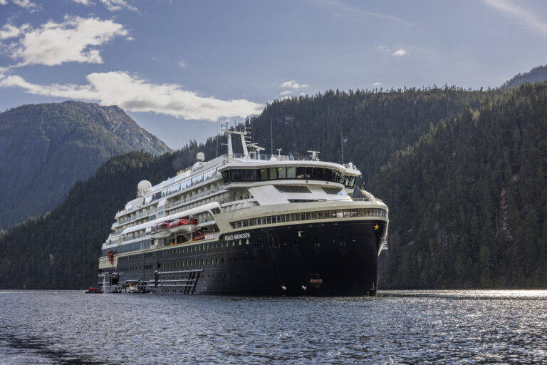 Luxury cruise ship sailing at sunset with ocean views – Whitestar Cruise and Travel holiday deals